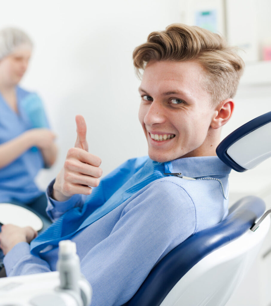 man giving thumbs up after dental appointment